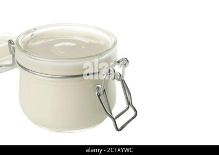 Glass jar of sour cream yogurt isolated on white background Stock Photo