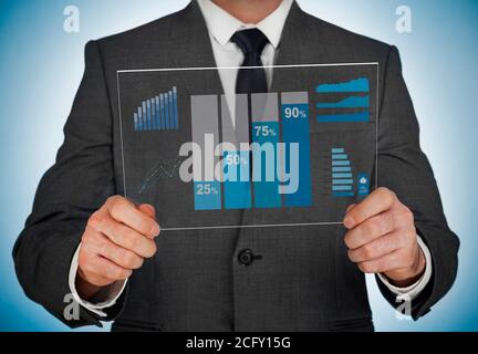 Businessman analyzing charts on modern screen Stock Photo