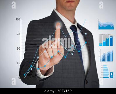 Businessman touching a virtual screen Stock Photo