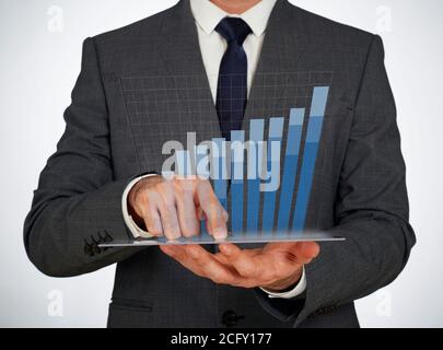 Businessman using a virtual screen Stock Photo