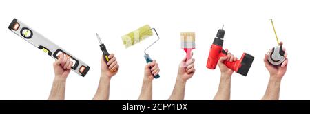 Hands raised holding different tools Stock Photo