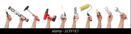 Hands raised holding different tools Stock Photo