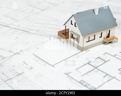 Model house on top of blueprints Stock Photo