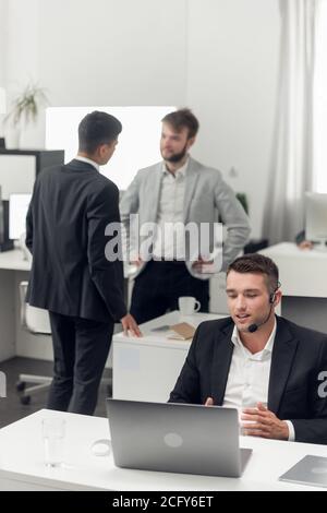 Telephone conversations with the customer of the company's Internet and it support service. Employee in the office. Stock Photo