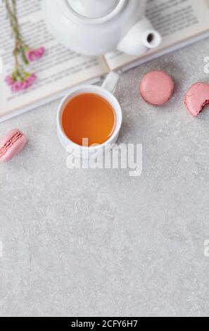 Tea and macaroons on table Stock Photo