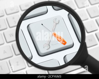 Screwdriver and wrench under magnifying glass on a keyboard Stock Photo