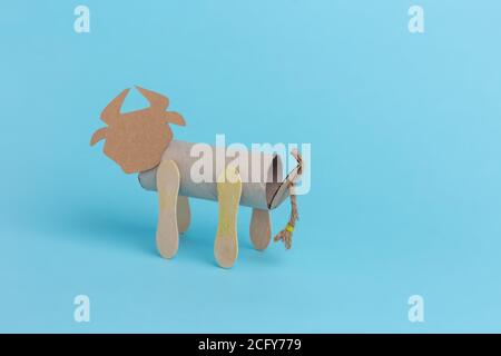 bull or ox made by kids from toilet paper roll, tutorial, DIY, step by step instruction, handmade craft for preschoolers Stock Photo