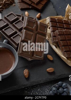 Raw dark chocolate bars on white background Stock Photo - Alamy