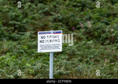 A Bradford Metropolitan Council sign in Baildon, Yorkshire, England. The sign is telling the public tipping and dumping isn't allowed. Stock Photo