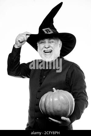 Wizard costume hat Halloween party. Magician witcher old man. Magic concept. Experienced and wise. Magic spell. Halloween tradition. Cosplay outfit. Senior man white beard celebrate Halloween. Stock Photo