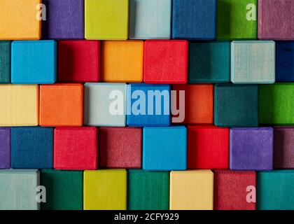 Multi-colored wooden toy blocks background Stock Photo