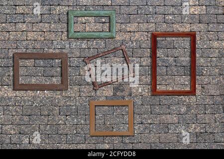 photo wooden frames on stone brick wall. For decoration or background Stock Photo