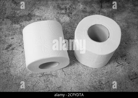 Top view of two rolls of toilet paper on gray texture background Stock Photo