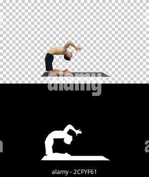 Yogi doing camel yoga pose, Alpha Channel Stock Photo