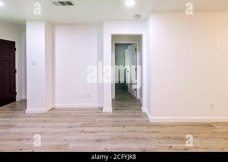 Empty living room with white walls and hardwood floor Stock Photo