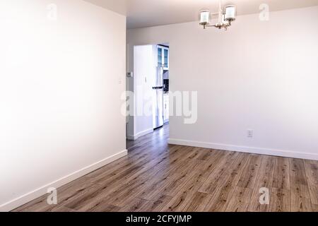 Empty living room with white walls and hardwood floor Stock Photo