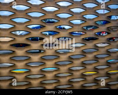 Geometric patterned grill with helicopter in the background Stock Photo