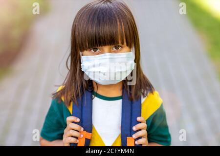 Little girl wearing protective mask Stock Photo