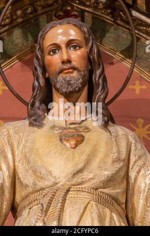 BARCELONA, SPAIN - MARCH 3, 2020:The carved polychrome statue of Heart of  Jesus in the chruch Iglesia Sant Ramon De Penyafort. Stock Photo