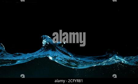 Abstract splashing water wave isolated on black background Stock Photo