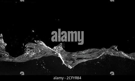 Abstract splashing water wave isolated on black background Stock Photo
