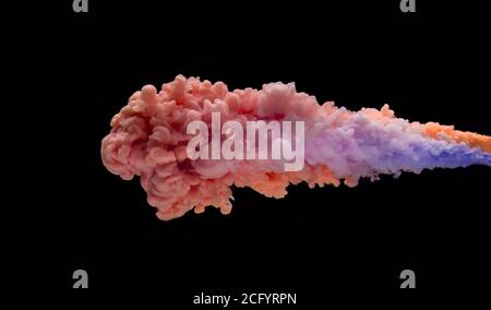 Coloured acrylic ink mixing in water isolated on black background. Abstract art background. Stock Photo