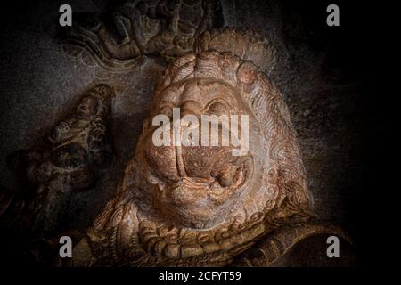 Ugra narasimha indian god stone face statue in Badami. Stock Photo