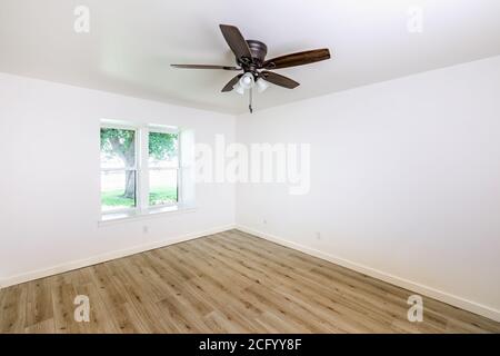 Empty living room, bedroom with white walls and hardwood floor Stock Photo
