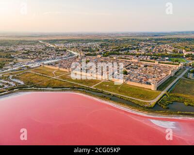 France, Gard, Petite Camargue, the medieval town of Aigues Mortes surrounded by the salt marshes (Salins du Midi) (aerial view) Stock Photo