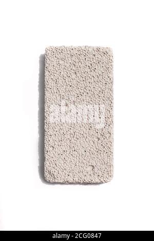 Pumice stone isolated on white background. Volcanic rock used for skin care. Stock Photo