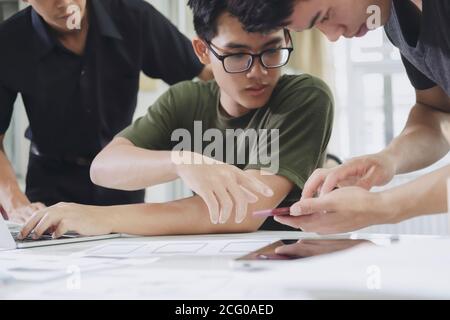 Programmer and UX UI designer working in a software development and coding technologies. Mobile and website design and programing development technolo Stock Photo