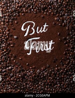 Coffee Beans around Fresh Coffee Grounds with Script Text "But First" Stock Photo