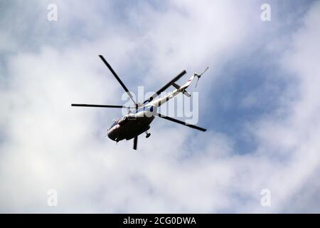 the helicopter is flying overhead Stock Photo