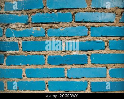 The brick wall painted in blue.A blue brick wall. Stock Photo