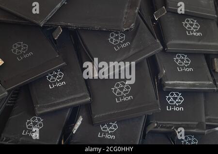 Close up of old used lithium polymer batteries of mobile phones preparation for recycling Stock Photo