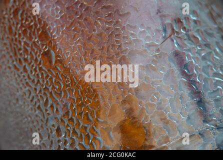 Plastic bottle texture background . Water drops due to condensation on a plastic bottle curved surface Stock Photo