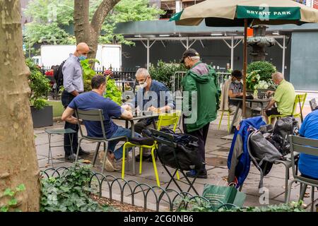 Chess players in Bryant Park in New York while wearing their masks on Wednesday, September 2, 2020.  (© Richard B. Levine) Stock Photo