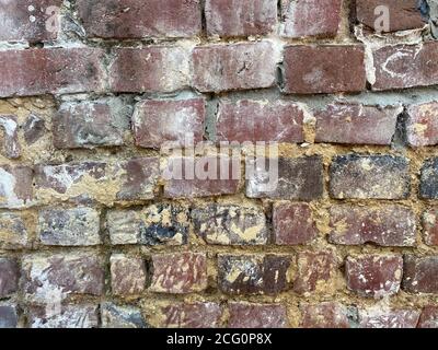 View on isolated old brick wall with cement Stock Photo