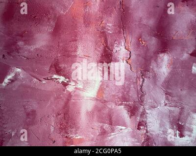 View on wall painted in wipe technique in purple, white and pink colors Stock Photo