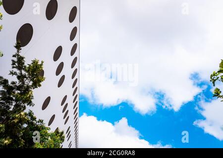 A modern office building with circular windows. Stock Photo