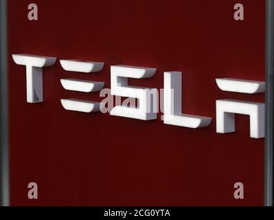 New York, United States. 08th Sep, 2020. A Tesla sign hangs at the entrance to a Tesla dealership on Tuesday September 8, 2020. Tesla shares have been falling since the electric vehicle maker was left out of the S&P 500 as a new addition to the index. Photo by John Angelillo/UPI Credit: UPI/Alamy Live News