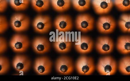Close up of the tops of a stack of new sharpened pencils. Stock Photo