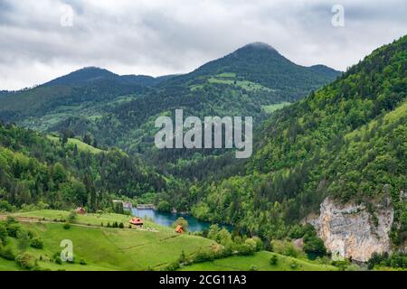 The village of Spajici and the village of Lazici, a small village with a couple of houses, with lake Spajica, near lake Zaovine, Stock Photo
