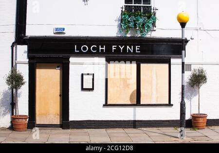 A boarded up Loch Fyne restaurant remains temporarily closed in