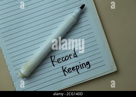 Record Keeping write on sticky notes isolated on office desk. Stock Photo