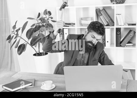 Software license agreement. Destroy laptop. Hateful job. Bad computer. Slow internet connection. Outdated software. Computer lag. Lagging system. Hate office routine. Man bearded crush computer. Stock Photo