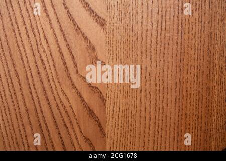 The structure of natural ash wood, tinted oak. Hardwood. Creative vintage background. Imitation of aging. Stock Photo