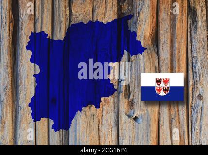 Map and flag of Trentino-South Tyrol (Trentino-Alto Adige), region of Italy, on wooden background, 3D Illustration Stock Photo