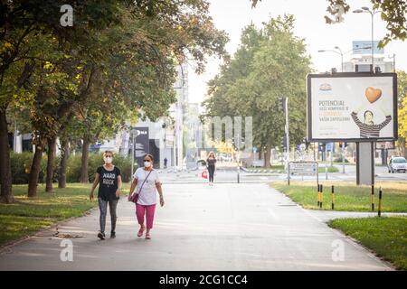 BELGRADE, SERBIA - AUGUST 23, 2020: Women, young girl and old woman, walking wearing face mask respiration protective equipement on Coronavirus Covid Stock Photo