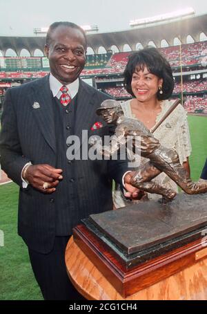 St. Louis Cardinals' Albert Pujols (L) and wife Diedra pose for a  photograph with National Baseball Hall of Fame member Lou Brock (R) and his  wife Jackie, before the annual Pujols Family